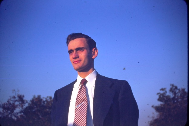 Bill Lucchini's father as a young man, standing outdoors in a suit
