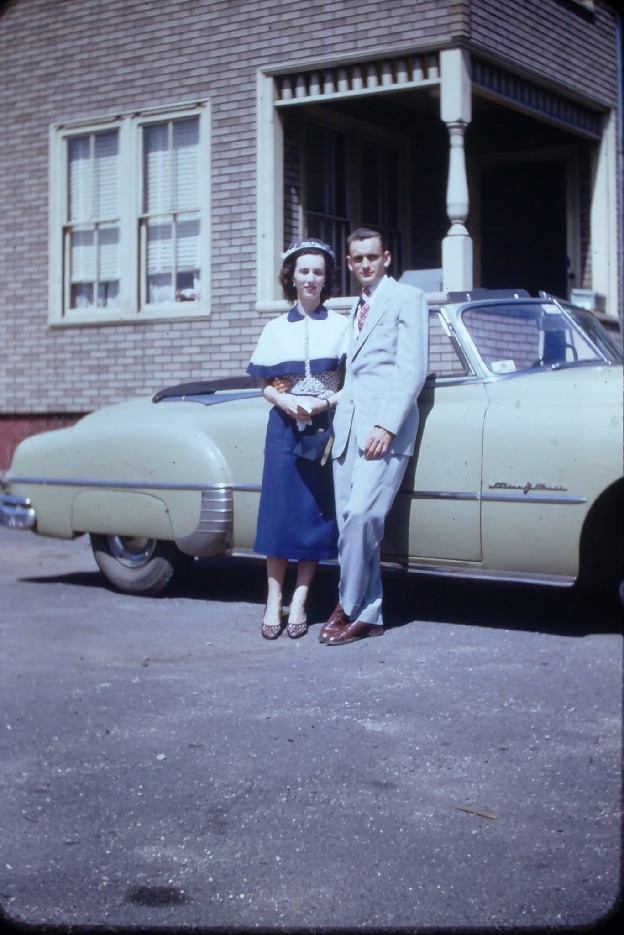Bill Lucchini's parents standing beside their car outside their home